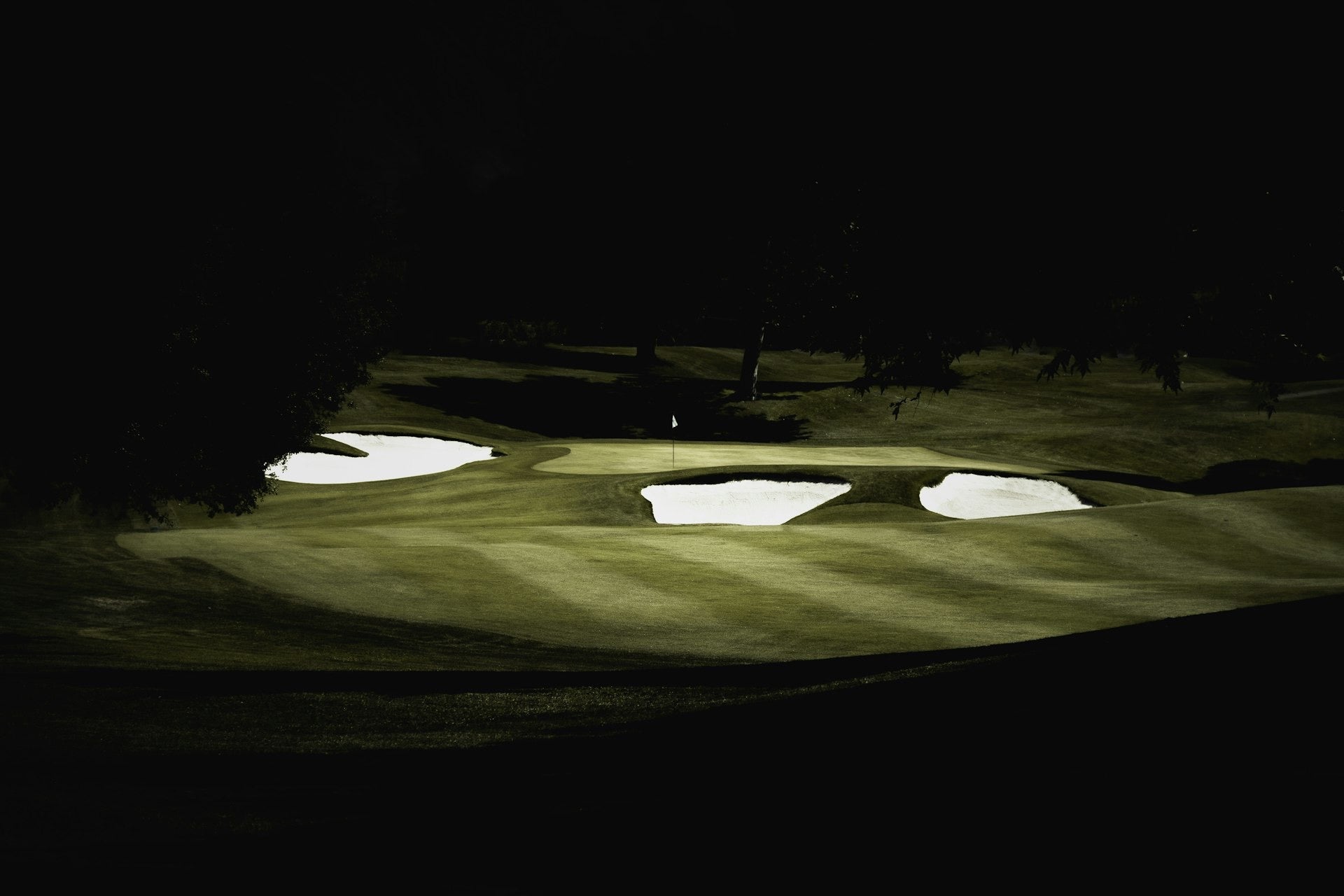 A green lit against the dark, long after everyone went home.